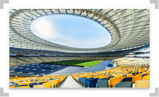Large empty stadium with open roof