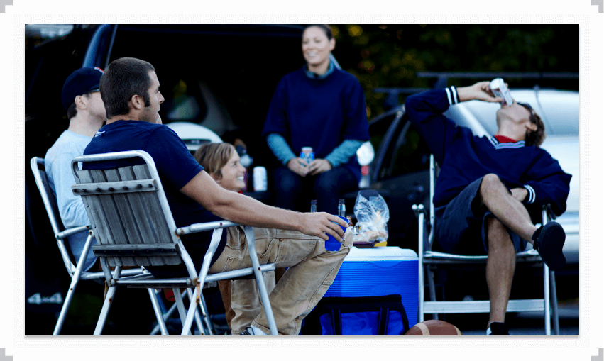 People hanging out at a tailgate party