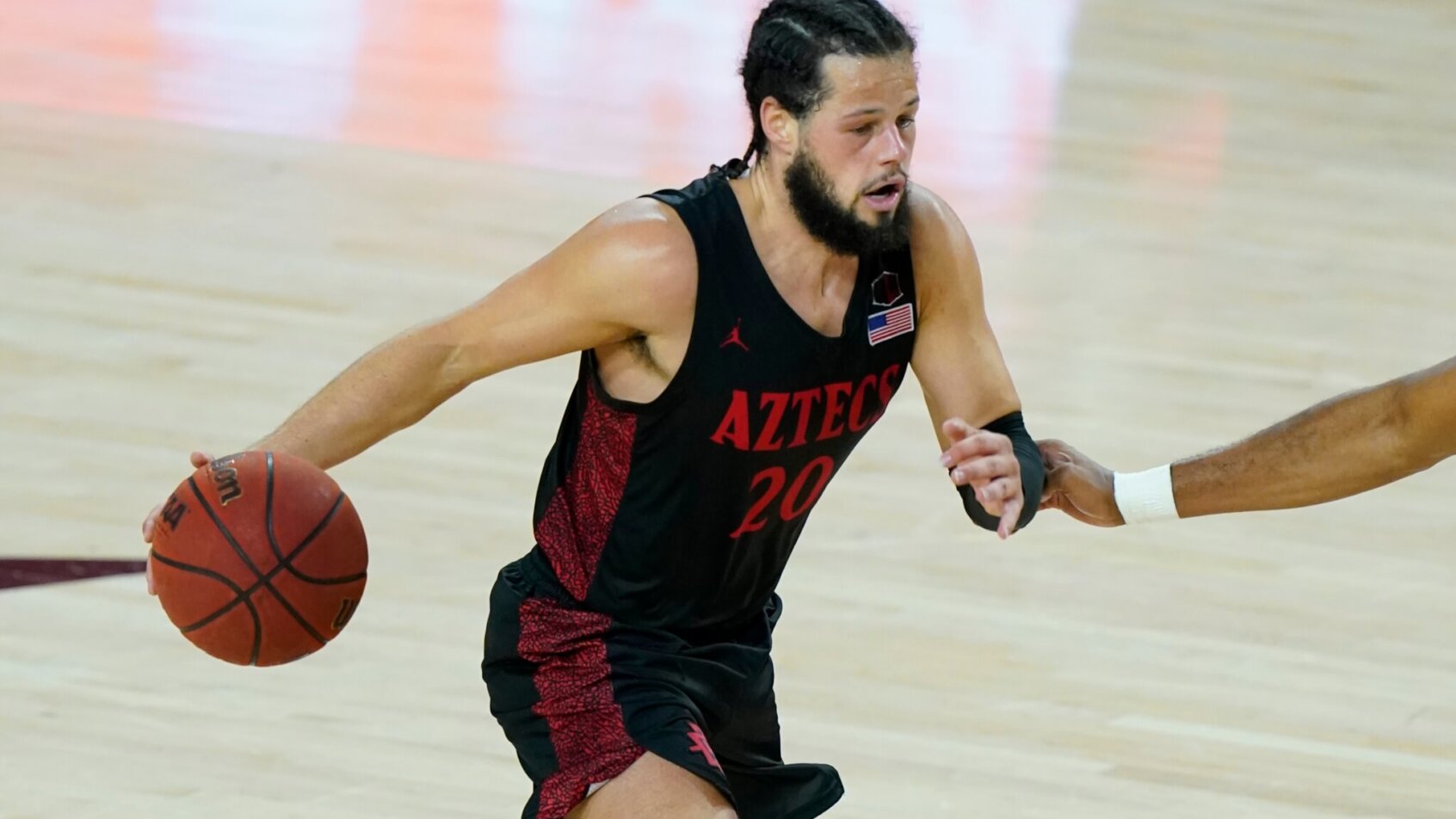 San Diego State guard Jordan Schakel dribbles the ball