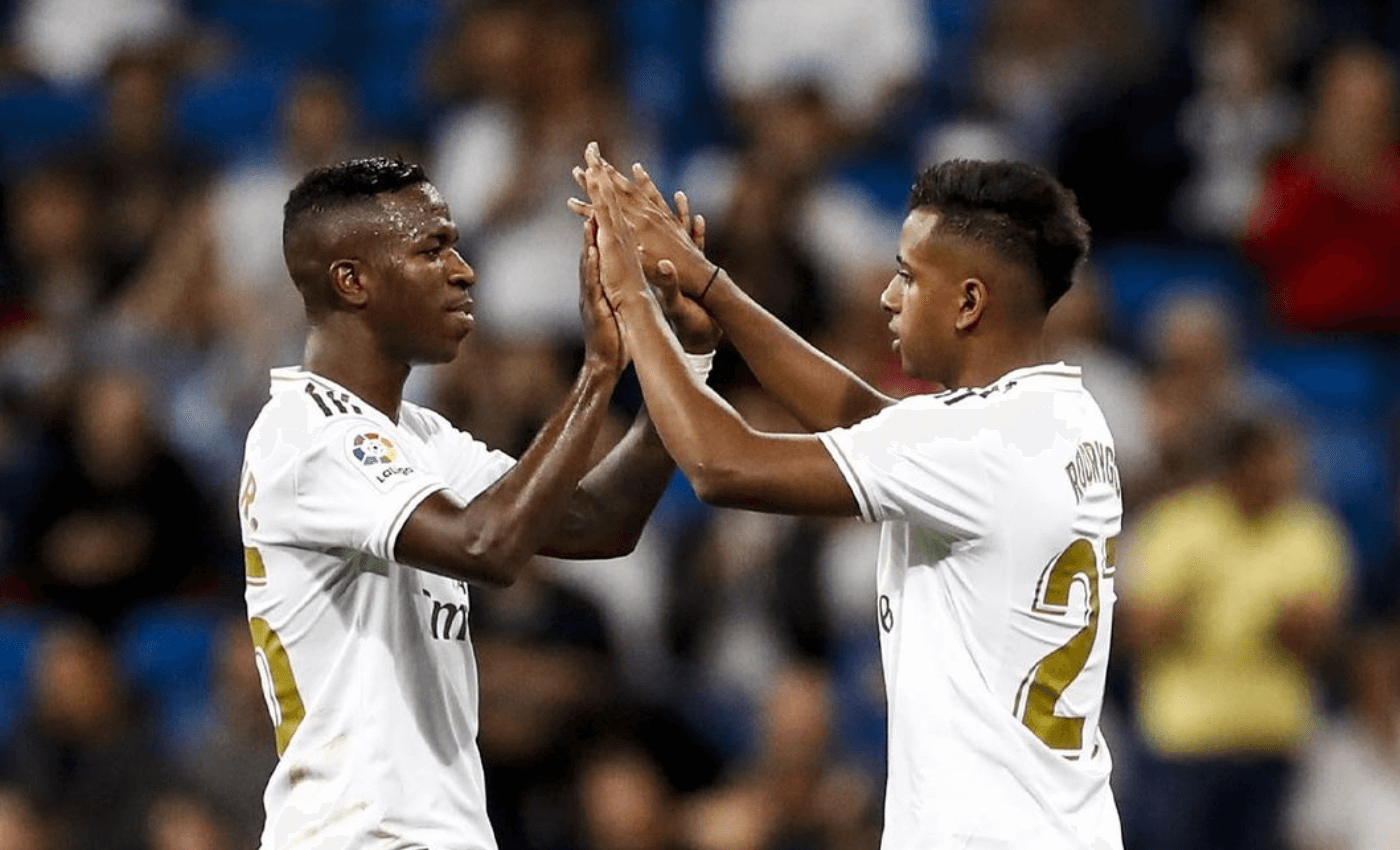 Vinicius and Rodrygo high-five on the pitch