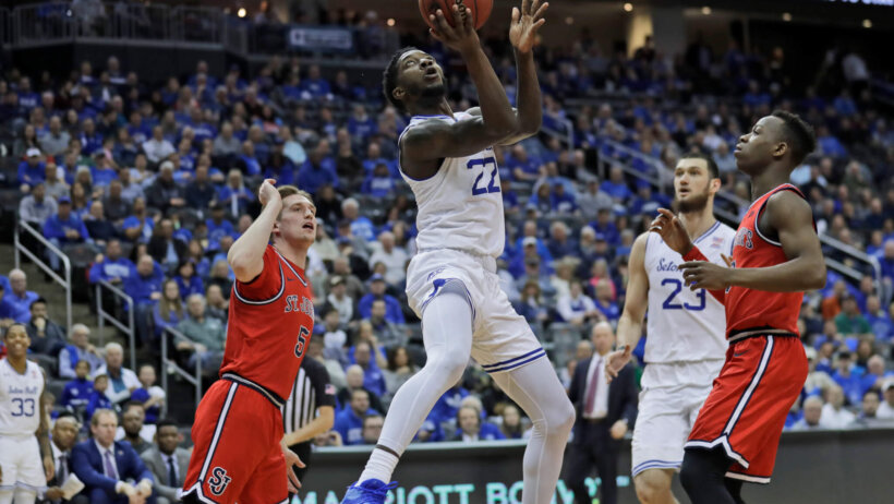 Myles Cale shooting a layup