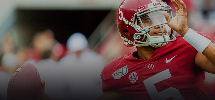 Taulia Tagovailoa throwing a football