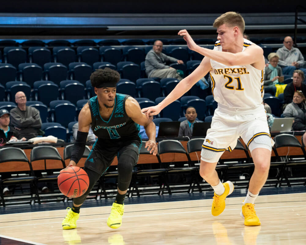UNCW Seahawks Guard Ty Gadsden (0) dribbles the ball