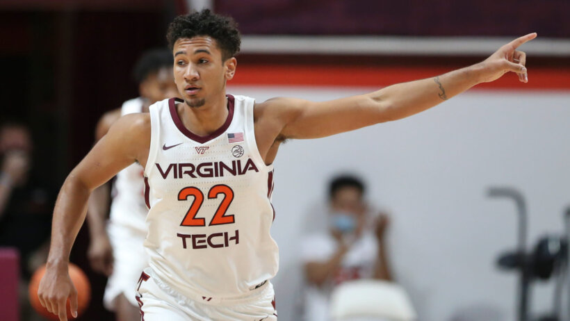 Virginia Tech's Keve Aluma points during the second half of an NCAA college basketball game against Miami