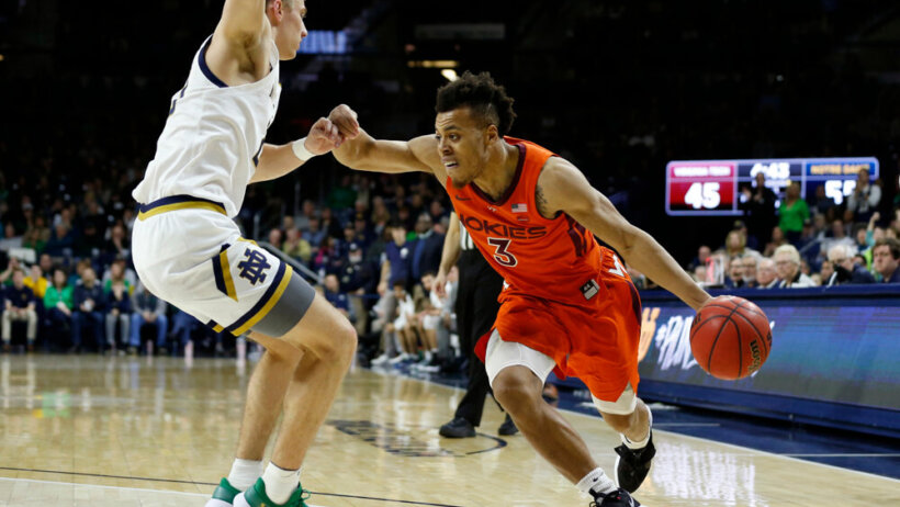 Virginia Tech Hokies guard Wabissa Bede dribbling around a defender