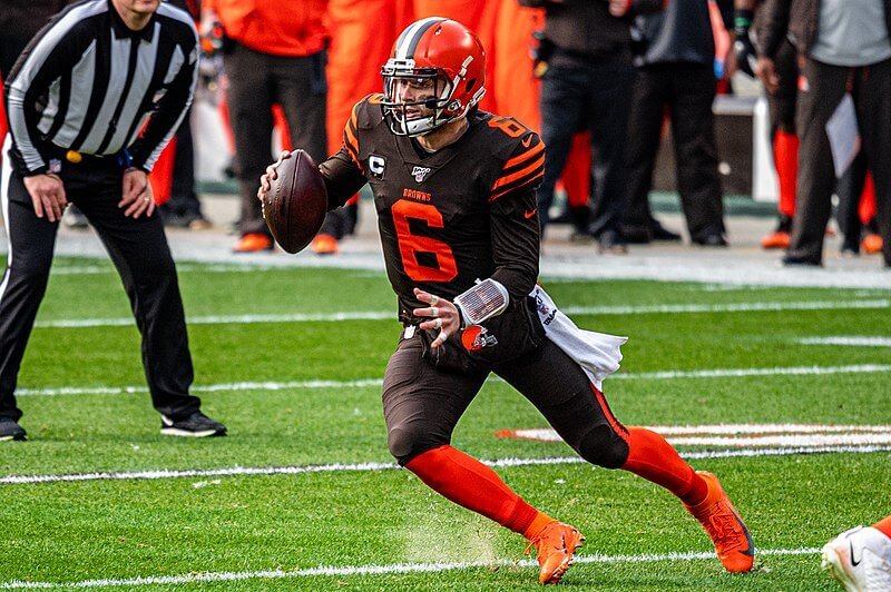Baker Mayfield running with football.