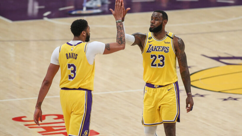 Anthony Davis and LeBron James hi-five each other