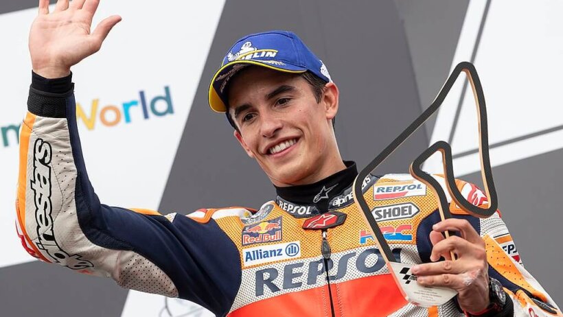 Marc Marquez waving from podium