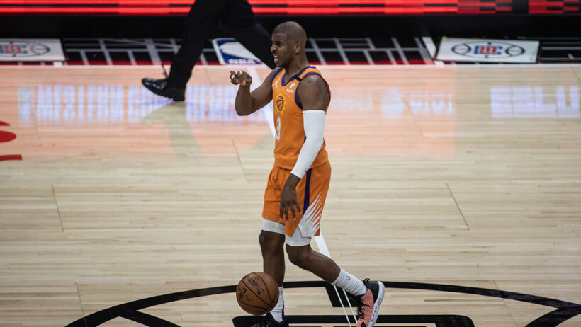 Chris Paul dribbling ball and pointing