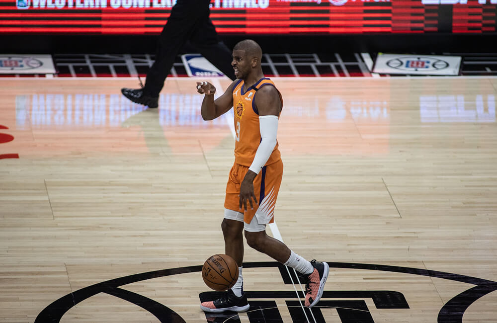 Chris Paul dribbling ball and pointing