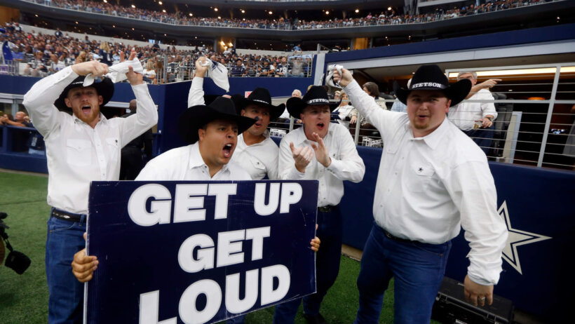 Cowboys fans cheering on the crowd
