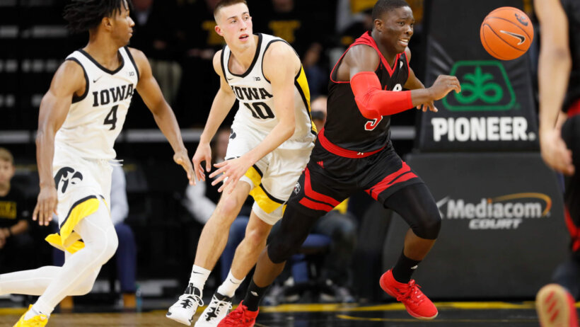 Mike Adewunmi chasing after basketball