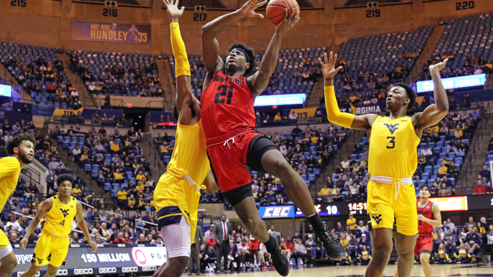 Terry Taylor shooting over defender for layup