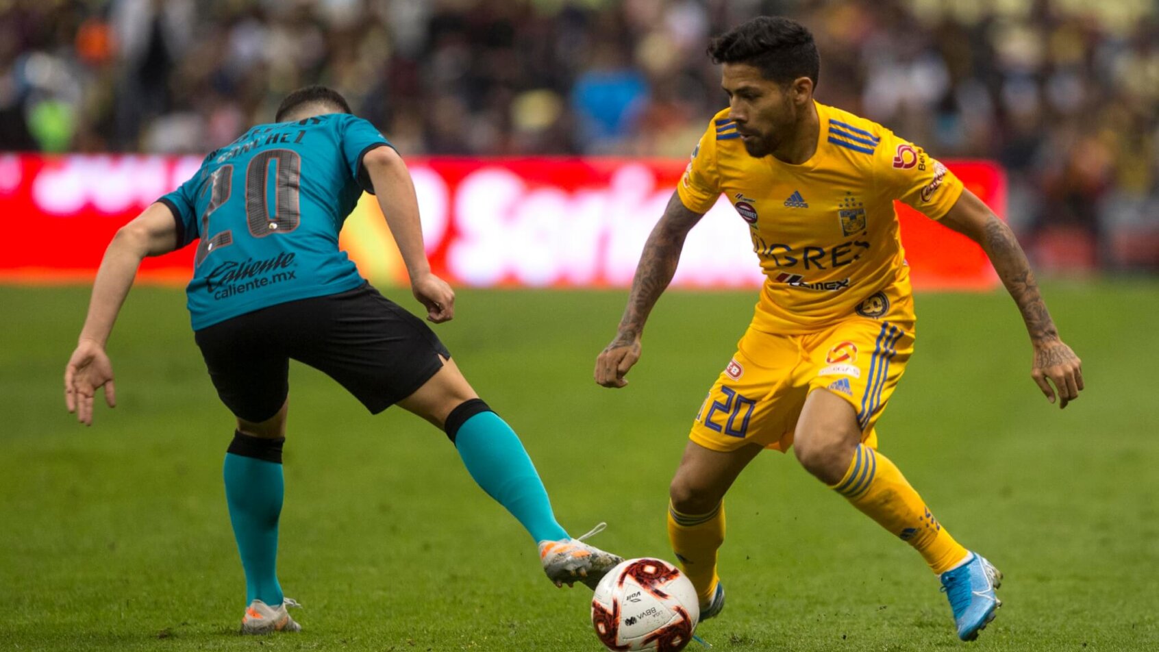 Two players fighting for soccer ball