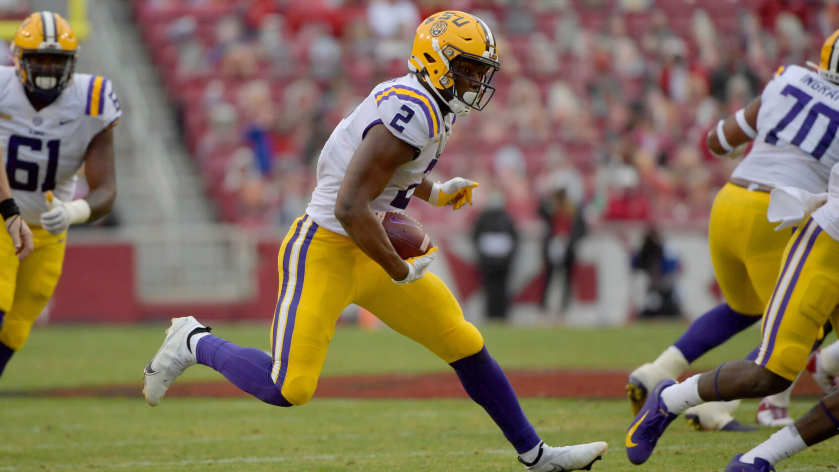 Arik Gilbert running with football