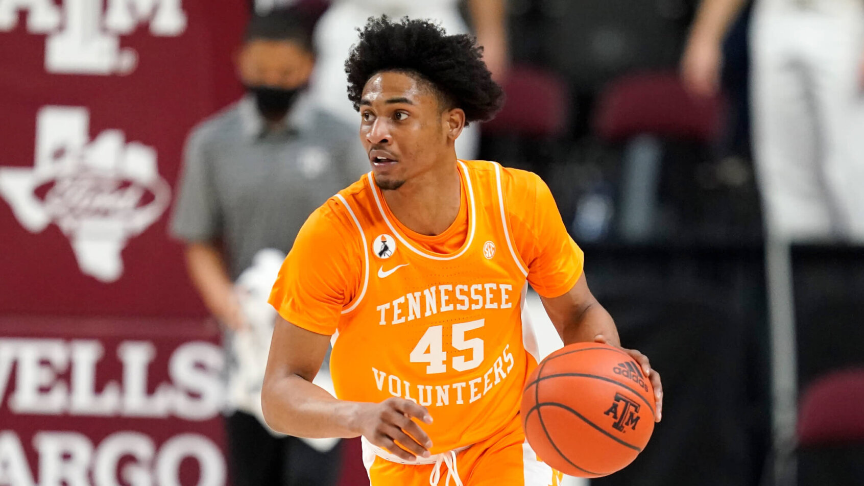 Tennessee guard Keon Johnson bringing the ball down the court during a NCAA men's basketball game.