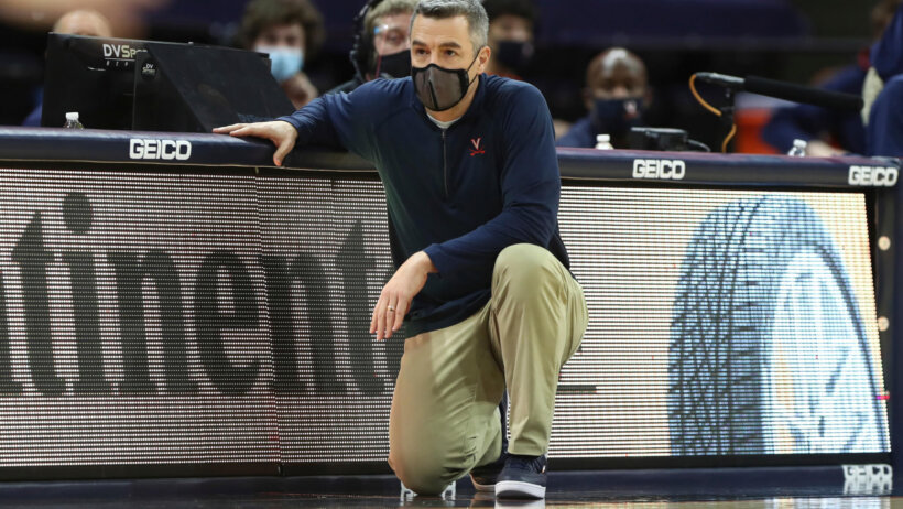 Tony Bennett kneeling with mask on