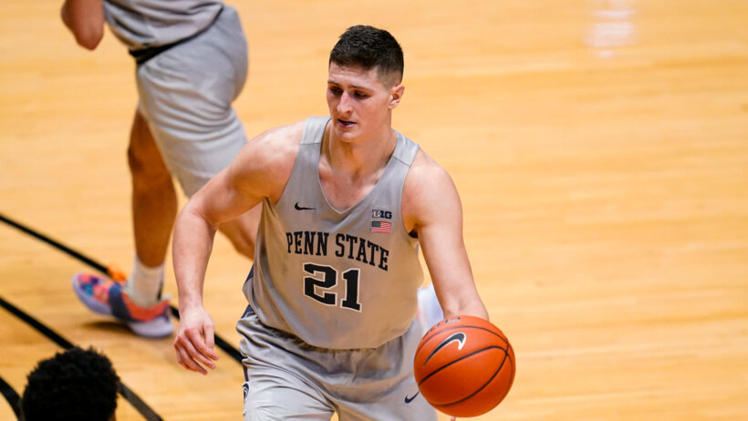 John Harrar with basketball in left hand