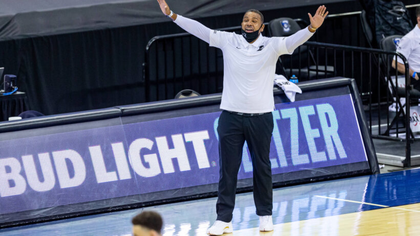 Ed Cooley arms up