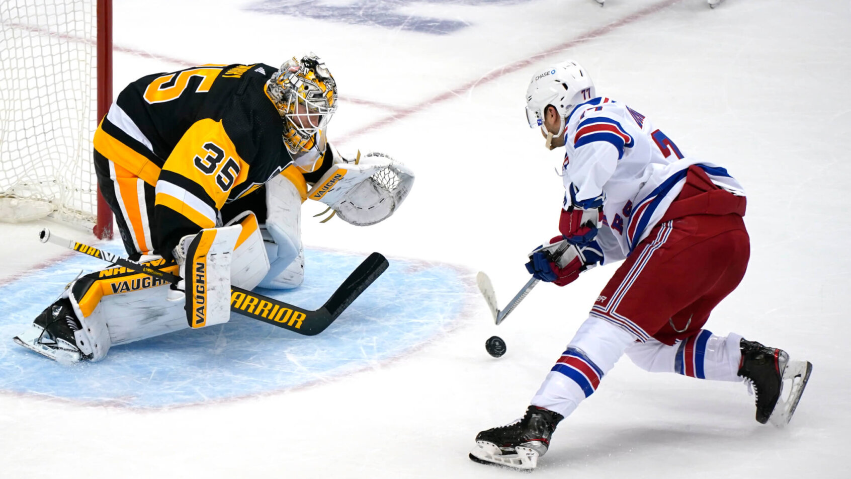 Pittsburgh Penguins goaltender Tristan Jarry blocking a shot by New York Rangers' Tony DeAngelo in a shootout.