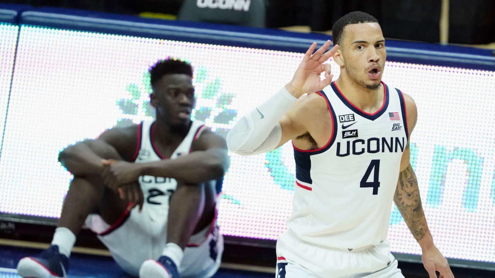 Connecticut guard Tyrese Martin reacting after making a shot during a game.