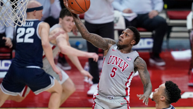 UNLV's David Jenkins Jr. shoots against Utah State during a college basketball game.