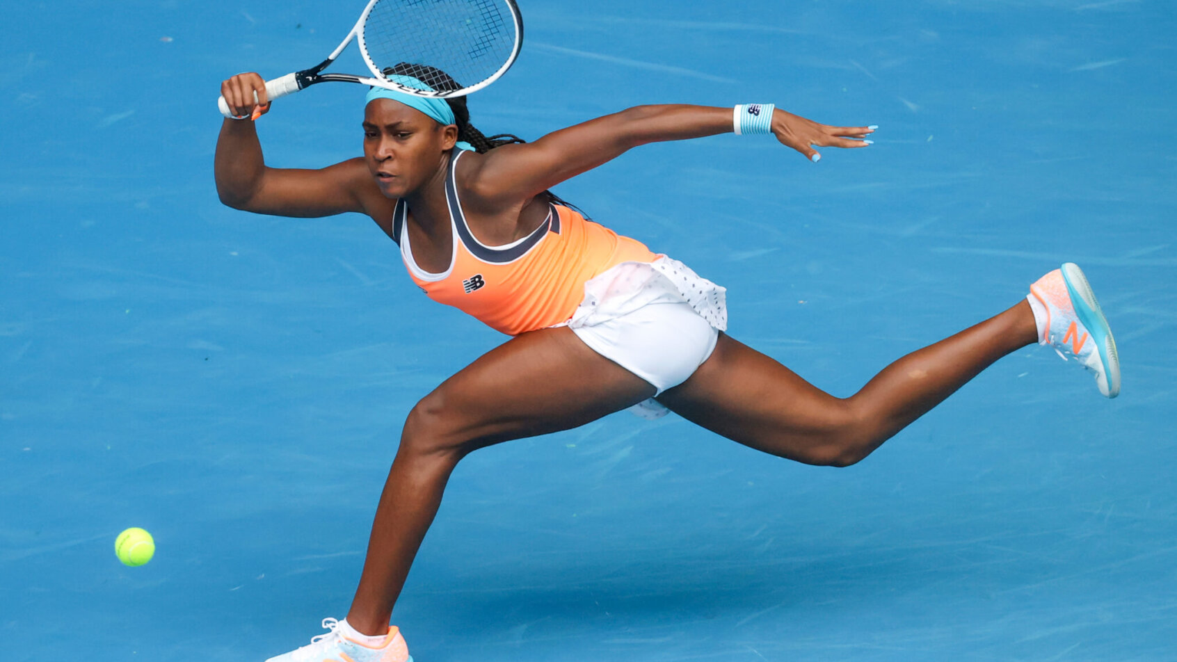 Cori Gauff of the United States stretching for a forehand return during a tennis match.