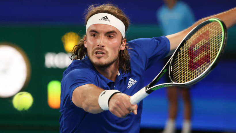 Greece's Stefanos Tsitsipas hitting a backhand during a match at the 2021 ATP Cup.
