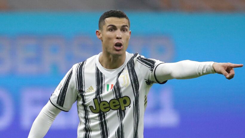 Cristiano Ronaldo pointing in response during a soccer match.