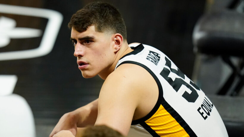 Luka Garza sitting on bench