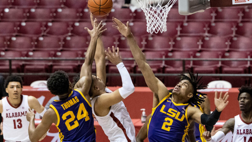 Cameron Thomas and Trendon Watford converge on Alabama player in the paint and contest his shot