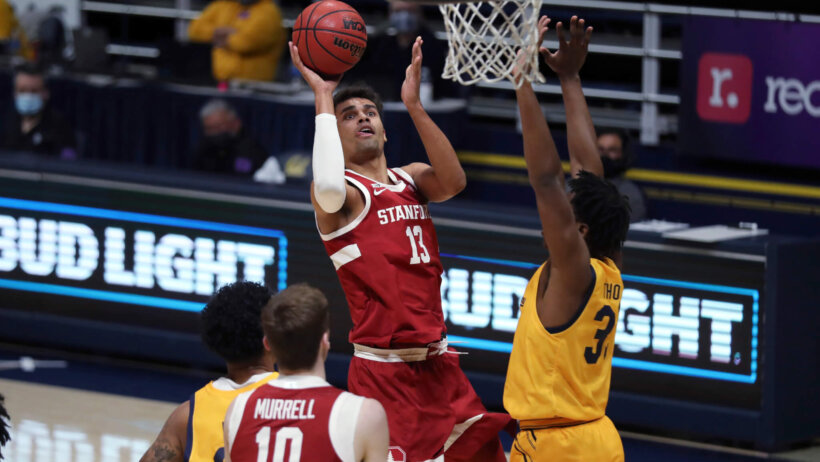 Oscar da Silva shooting over defenders in the paint