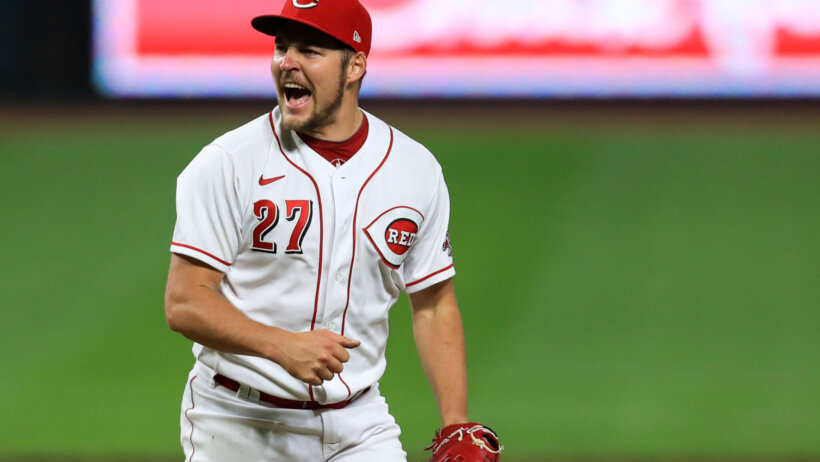 Cincinnati Reds' player Trevor Bauer showing an excited reaction.