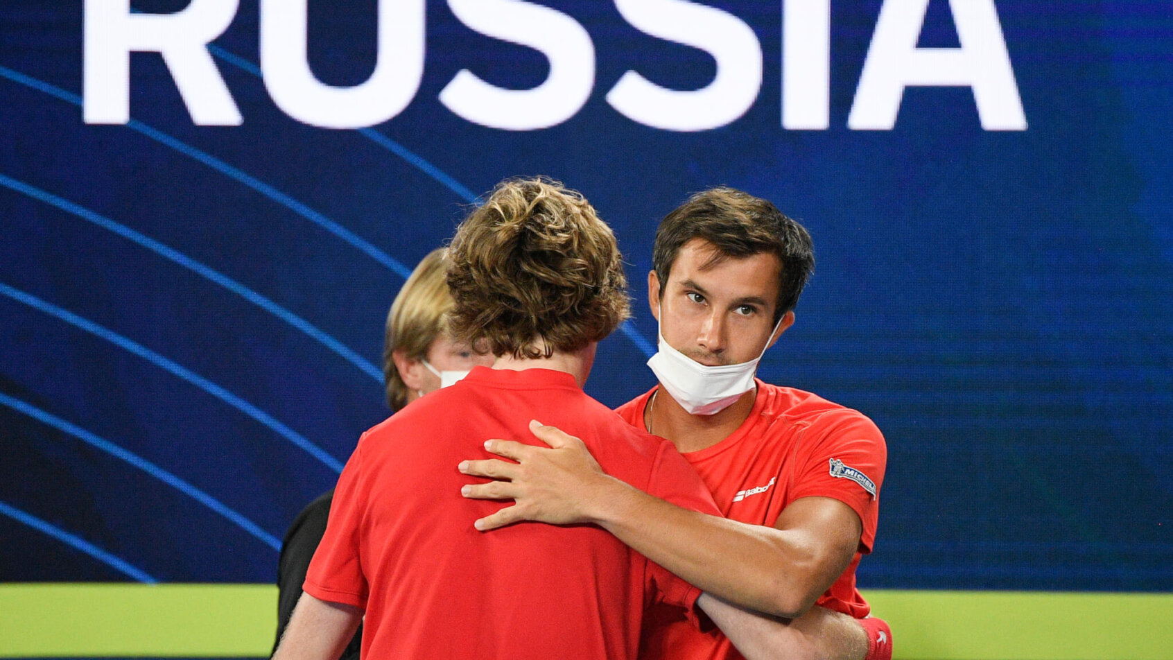 Russia's Andrey Rublev celebrating with her teammates after winning a match.