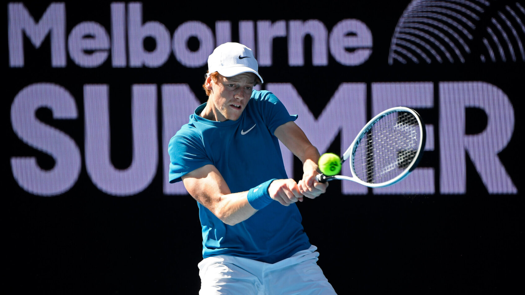 Jannik Sinner swinging backhand