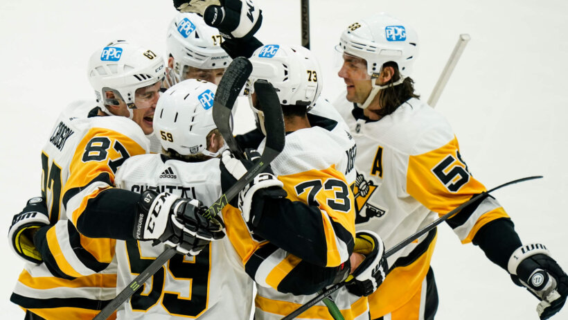 Pittsburgh Penguins players celebrating a goal