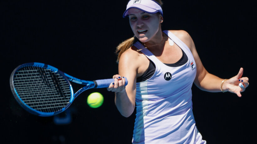 Sofia Kenin hitting a forehand return in a match at the Australian Open.
