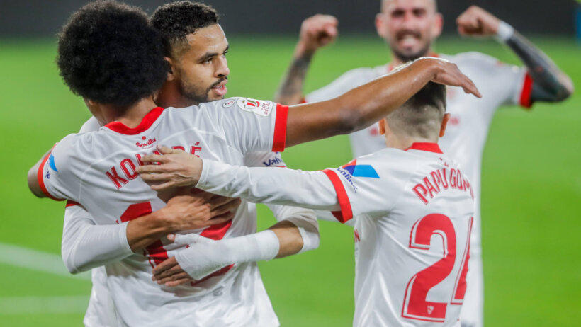 Sevilla's Jules Kounde celebrating with teammates after scoring a goal during a Spanish Copa del Rey soccer match.