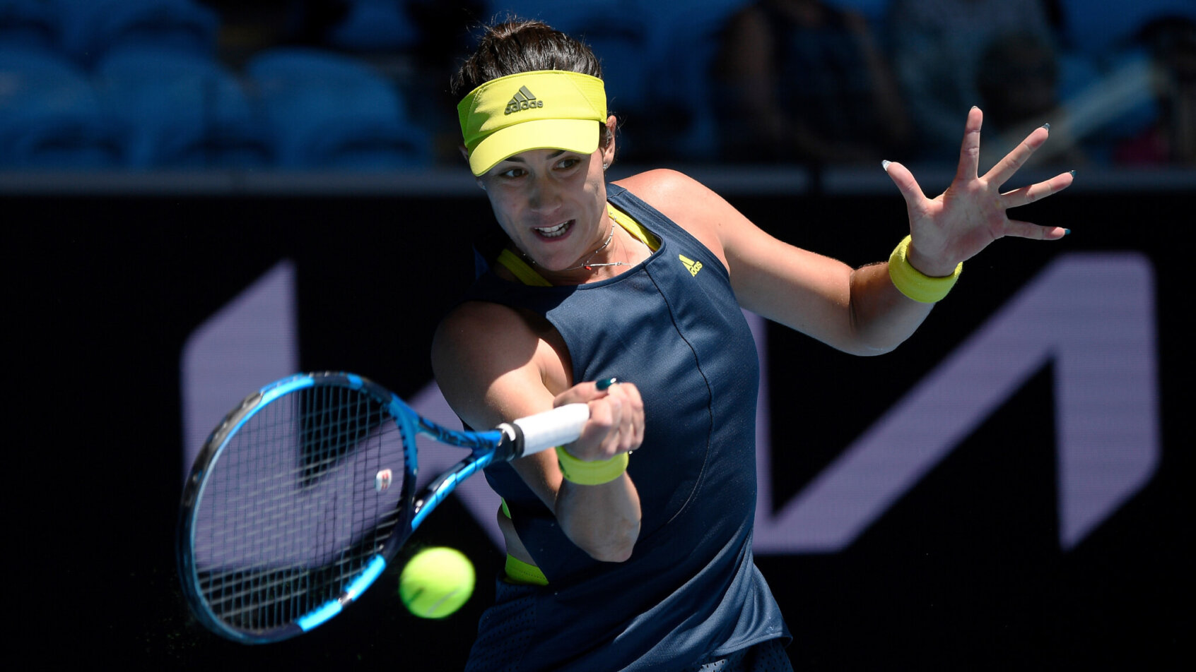 Garbine Muguruza hitting a forehand return during a tennis match.
