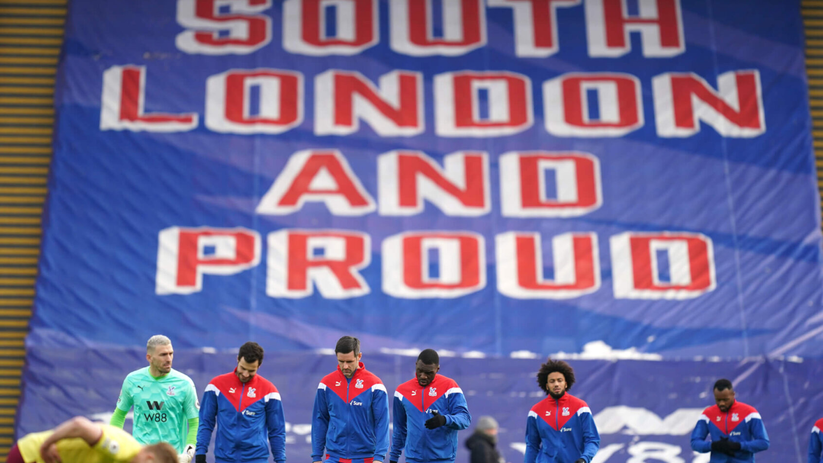 Crystal Palace players arriving and walking on the field ahead of their English Premier League soccer match.