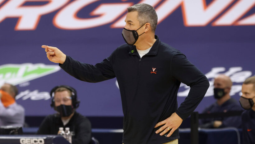 Virginia coach Tony Bennett calling a play from the sidelines during a NCAA men's basketball game.