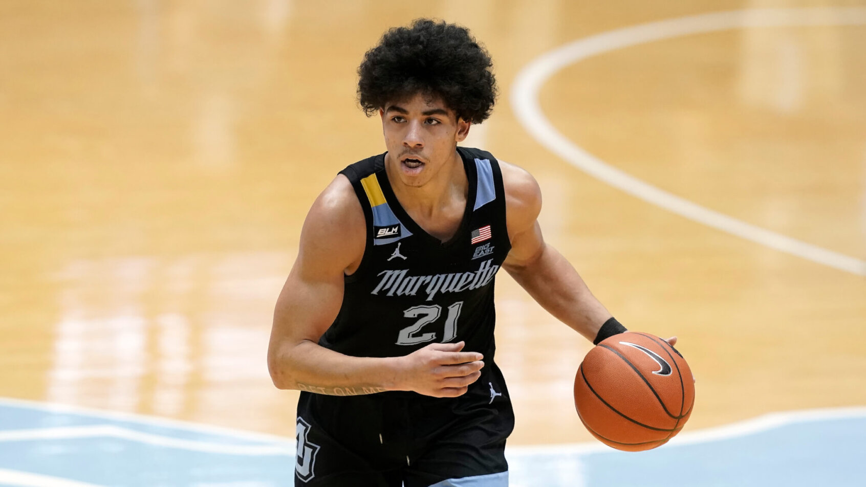 Marquette guard D.J. Carton dribbling