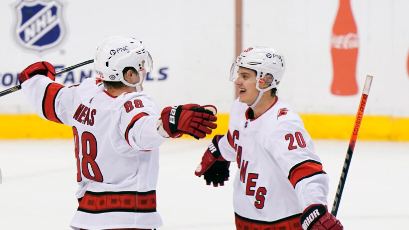 Martin Necas and Sebastian Aho celebrate