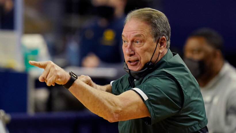 Michigan State head coach Tom Izzo yelling and pointing from the sidelines during a NCAA men's basketball game.