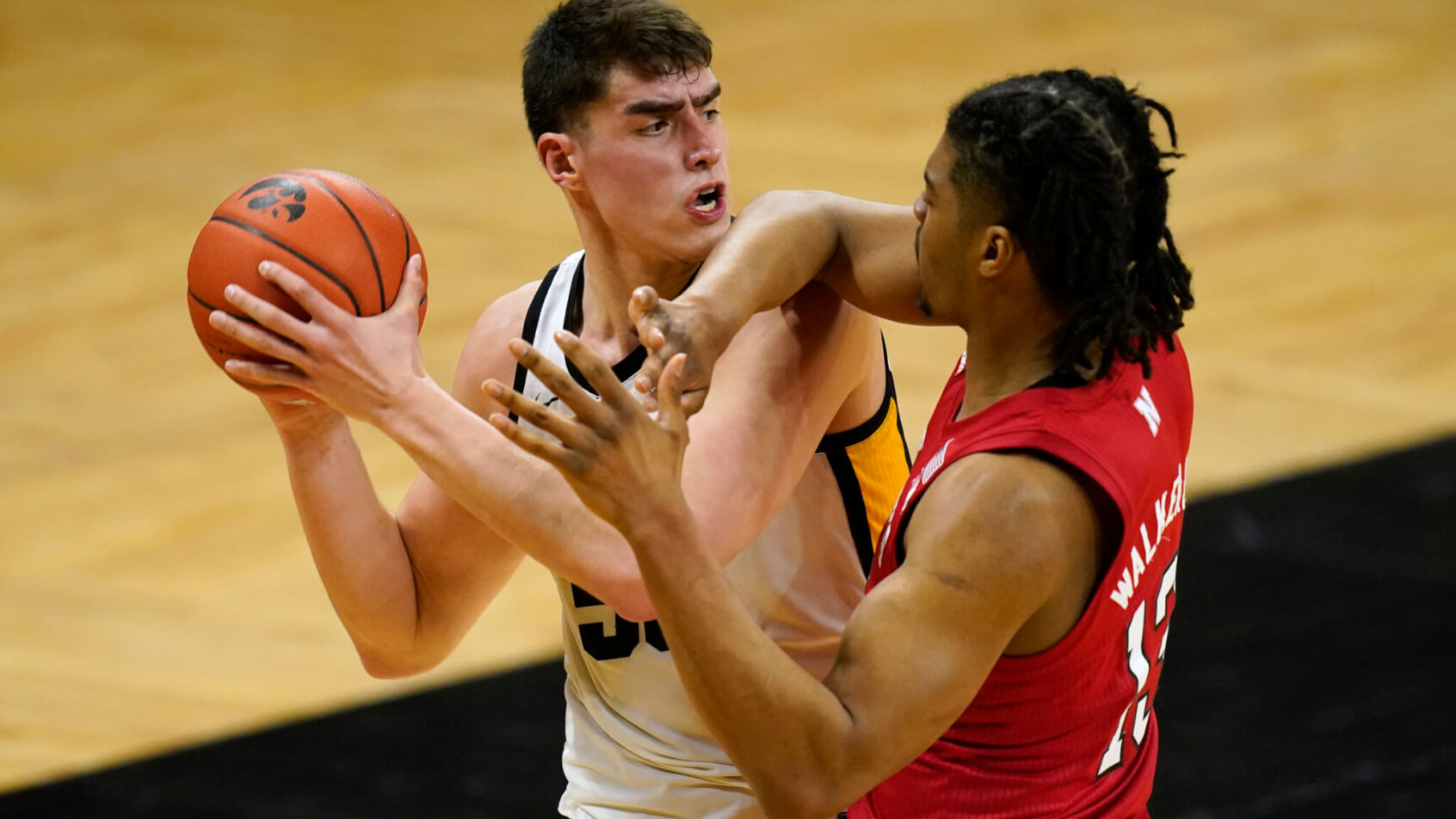Luka Garza pressured by defender, looking to pass