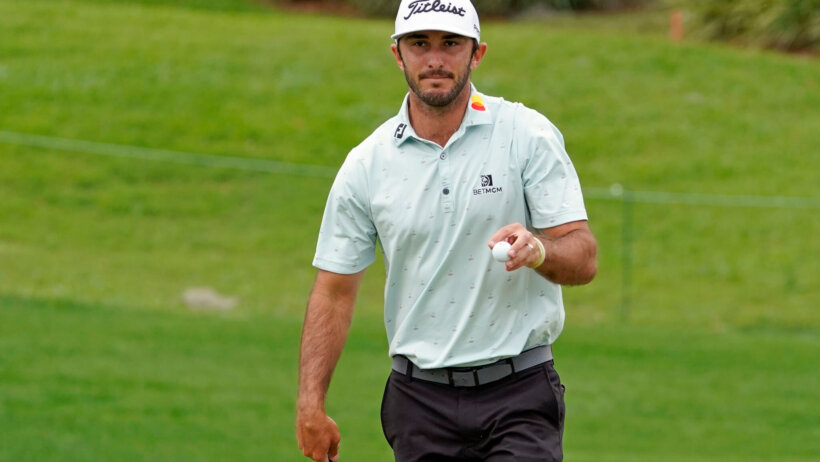 Max Homa holding golf ball
