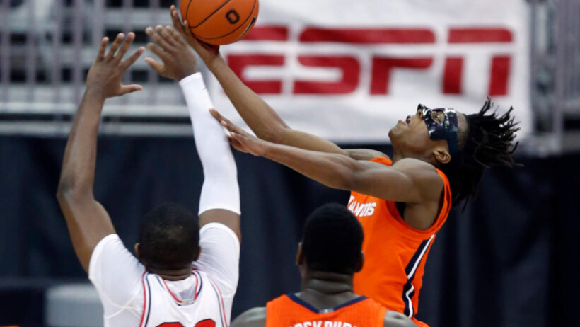 Ayo Dosunmu shooting over defender