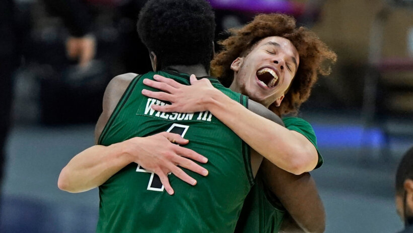 Jason Preston, Dwight Wilson III hugging celebration
