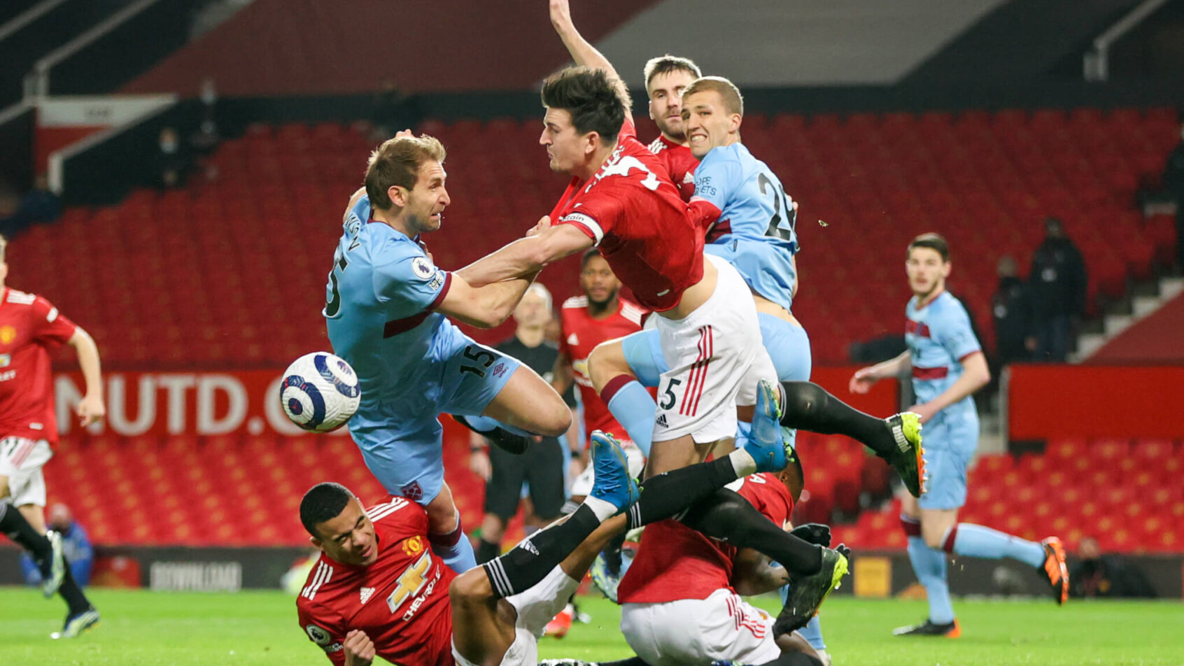 A large scrum of players fighting for possession of the ball