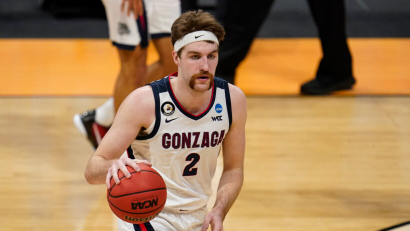 Gonzaga forward Drew Timme dribbling the ball during a NCAA March Madness game.